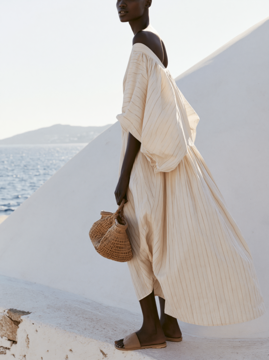 Zanzibar fashion portrait in a flowing cream dress